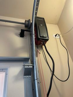 Overhead Garage door opener broken spring off track replace adjustment and parts