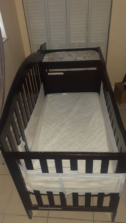 Cherry wood crib includes, mattress liner, Hand and foot guard, bed mattress , and changing table mattress
