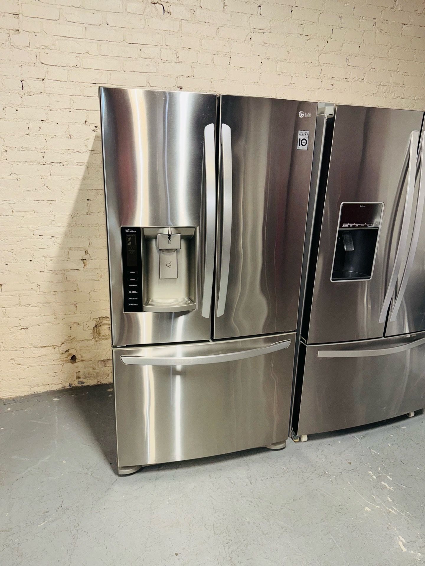 LG Stainless Steel Refrigerator (36" x 69" x 29) — Includes a receipt for a 90-day warranty.