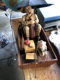 Old man boat figure with dog