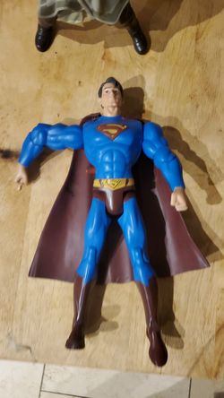 Super man action figure toy that moves arms with button for children