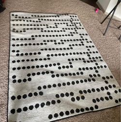 Carpet Modern Black & White Area Rug – 53” x 77”  Stylish contemporary area rug featuring a unique black and white geometric dot pattern. The neutral 