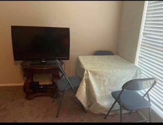 TV and desk and chairs