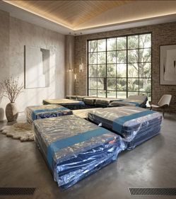 New Mattresses Still in Plastic Wrap