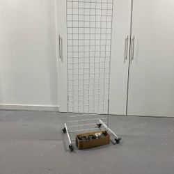 Merchandising Rack With Peg Hooks