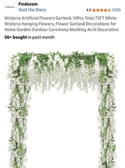 Roughly 15 fake white wisteria and 2 greenery vines