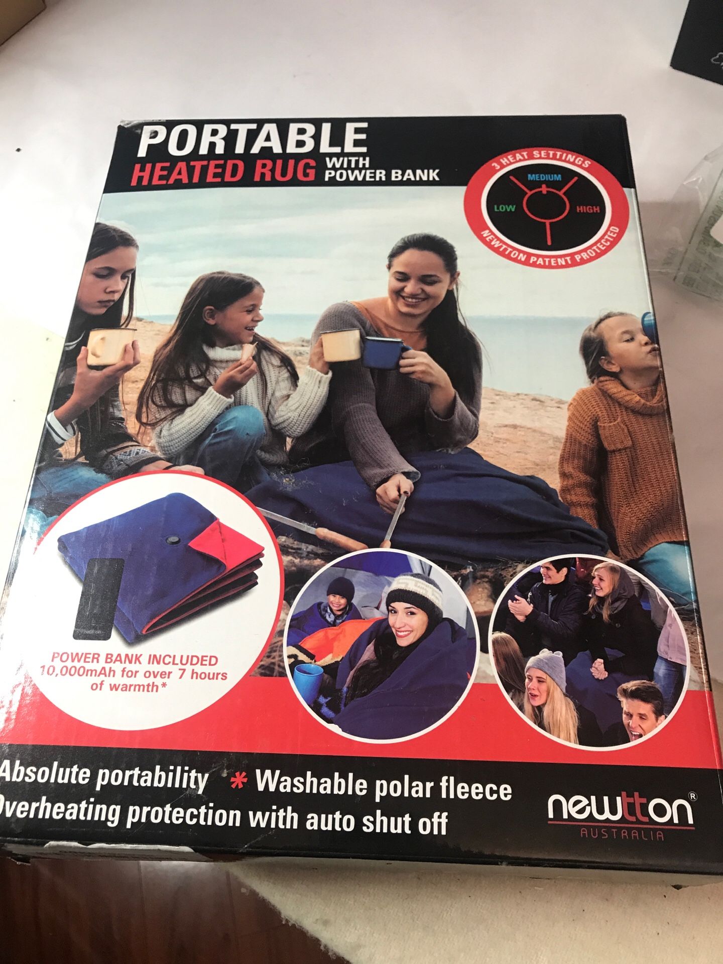 Portable heated rug/blanket