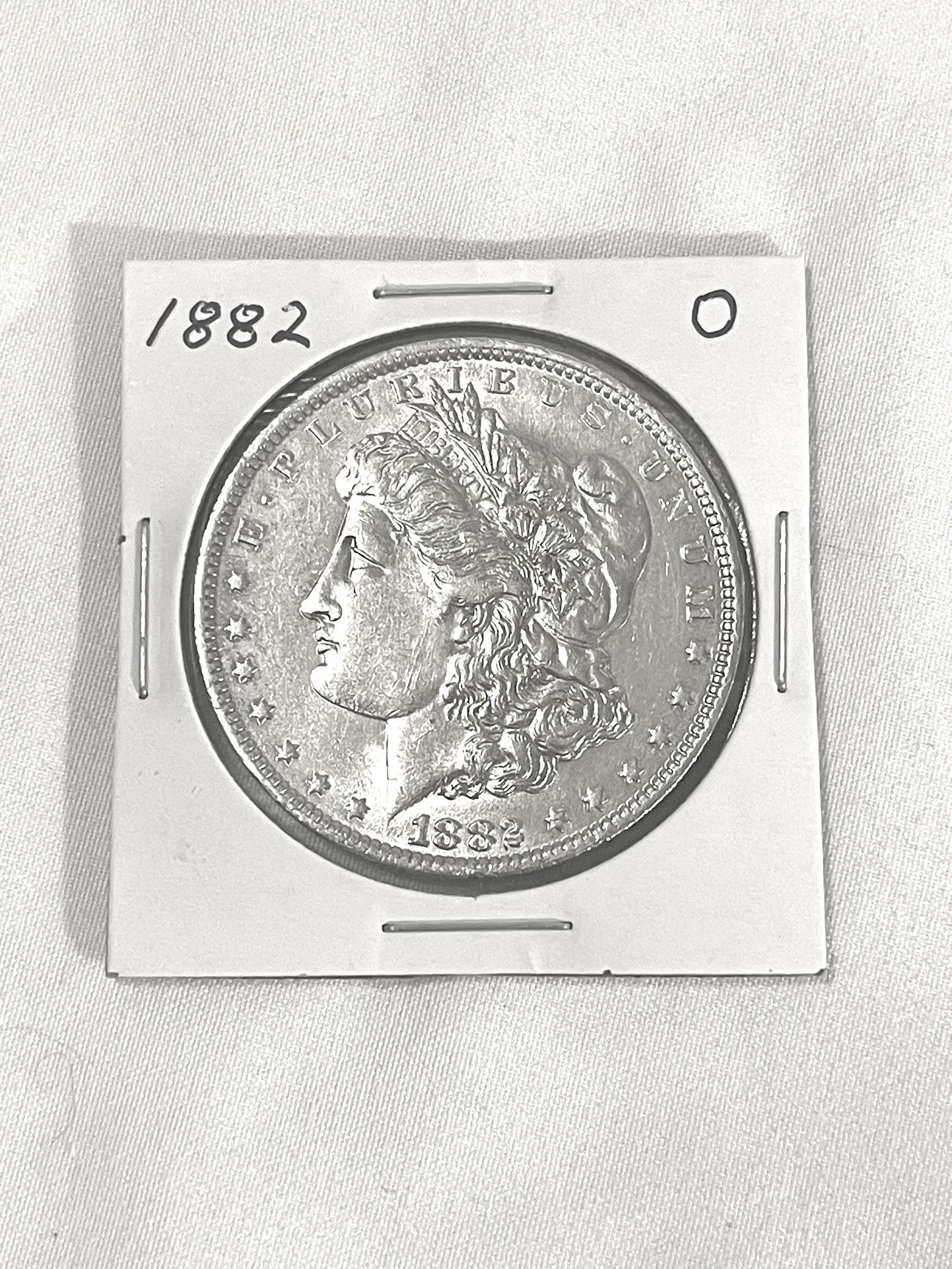 About Uncirculated-AU(50)  1882-O Morgan Silver Dollar. Valued at $72 on US Coin book in this condition