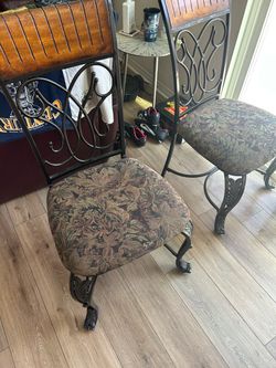 Four wrought iron chairs