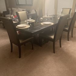Black Table With Silver Padding Chairs