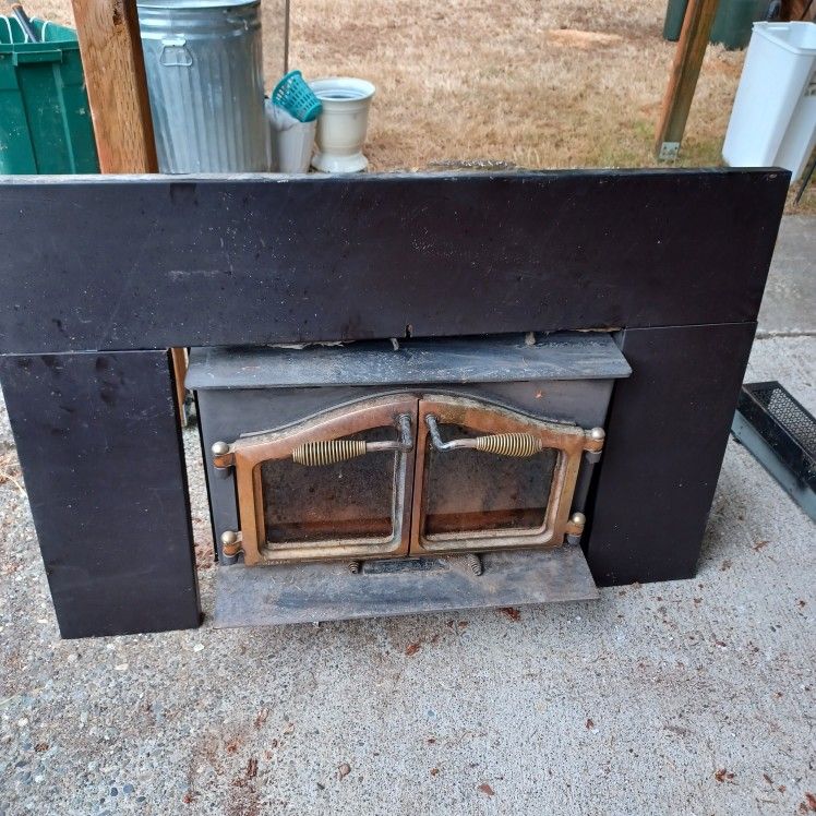 Majestic Fireplace Woodstove Insert with Fan and Surround.