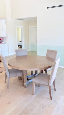 Beautiful round wood dining table with 4 upholstered chairs