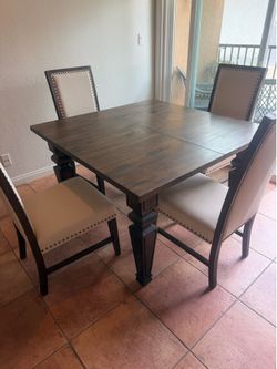 Sold wood table with 4 chairs