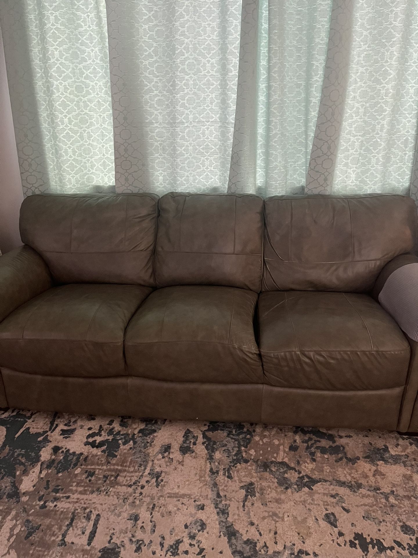 Gray Leather Couch. Good Condition. Pick Up Only.