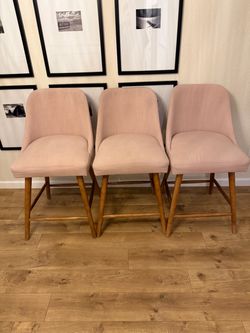 3 pink barstools