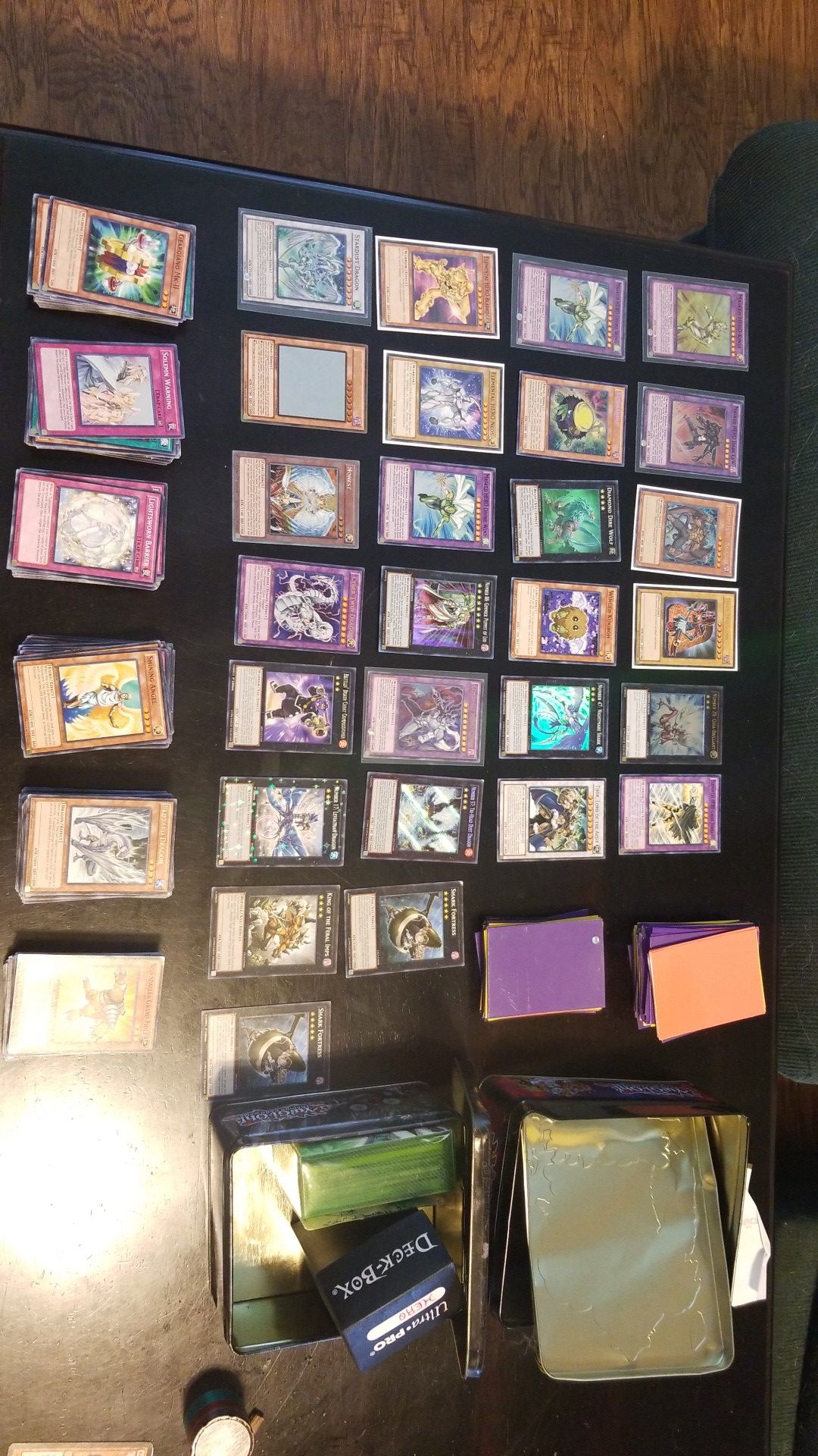 Yugioh cards w/sleeves, deck boxes, and tin cases
