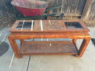 vintage Asian/Chinoiserie-style wood coffee table with two inset glass panels