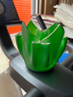 Elegant vintage 4 inch tall, green glass flower shaped candle stick holder Elegant vintage 4 inch tall, green glass flower shaped candle stick holder