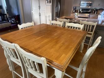 Counter height expandable dining table with eight chairs