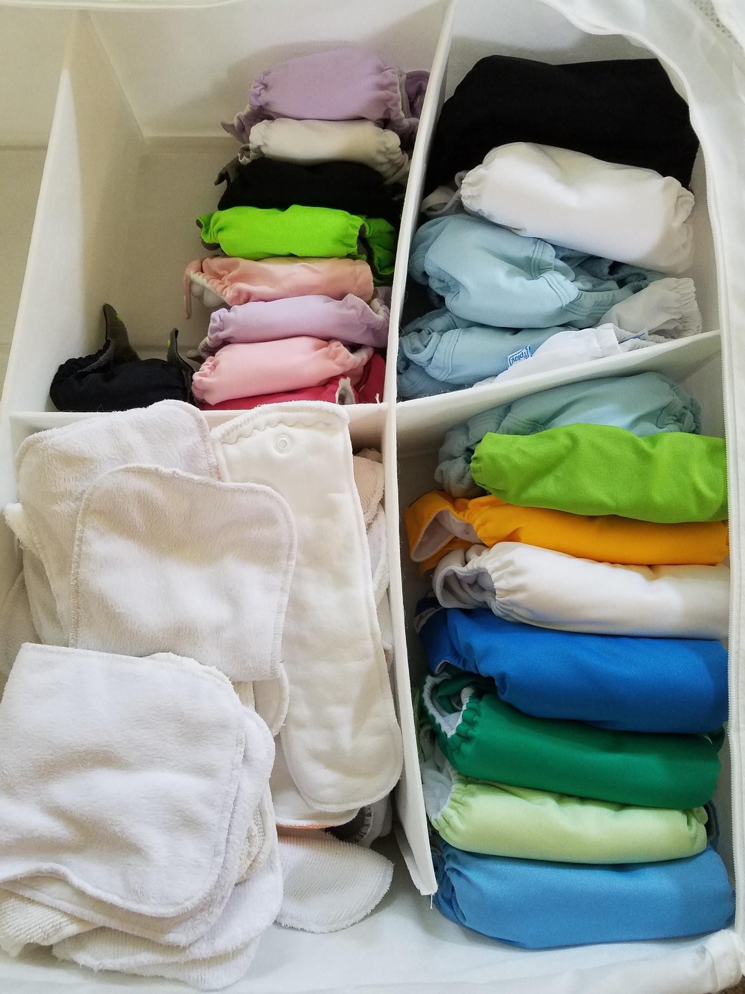 53 Cloth diapers with additional items. OBO