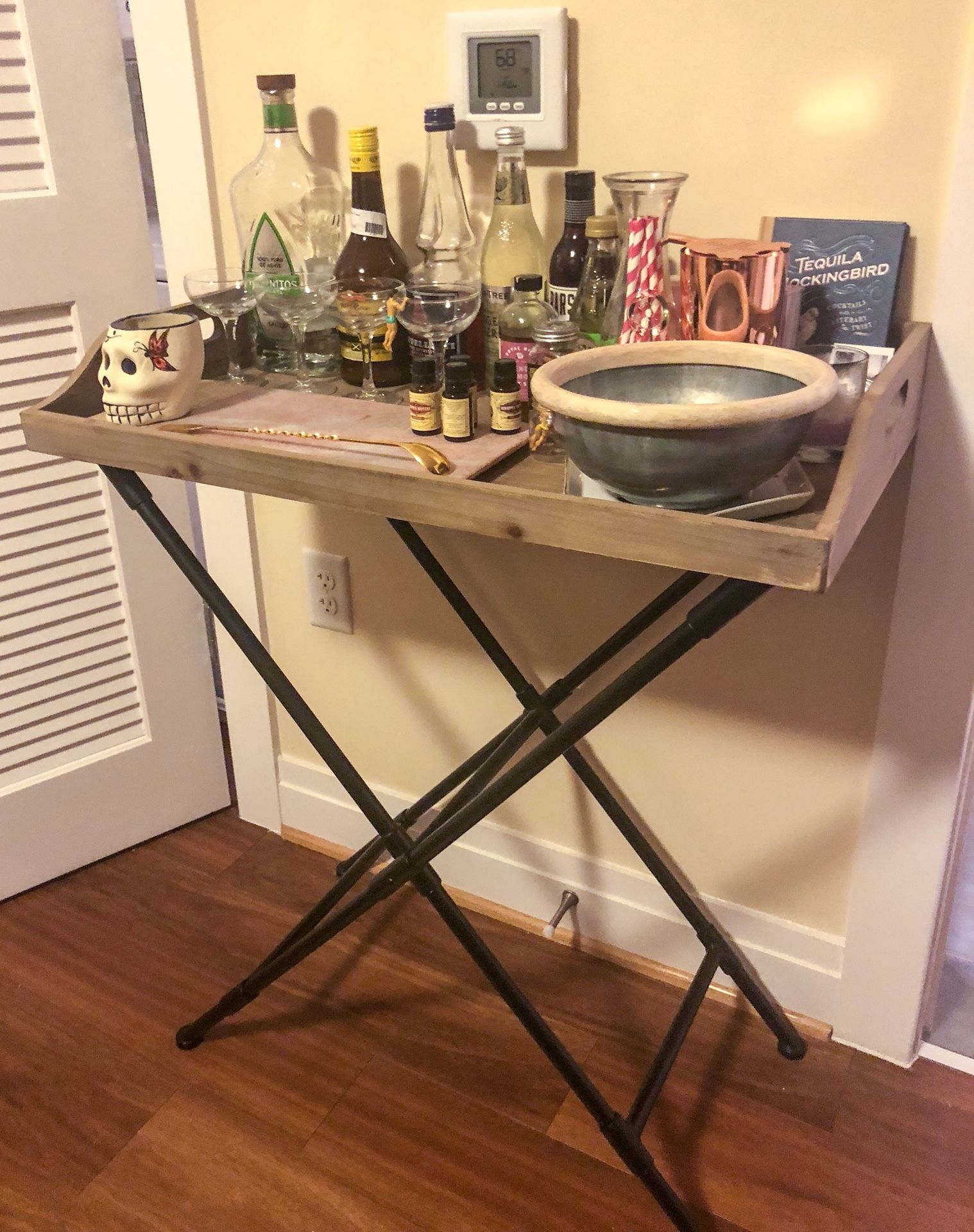 West Elm wooden folding tray table, used as bar cart