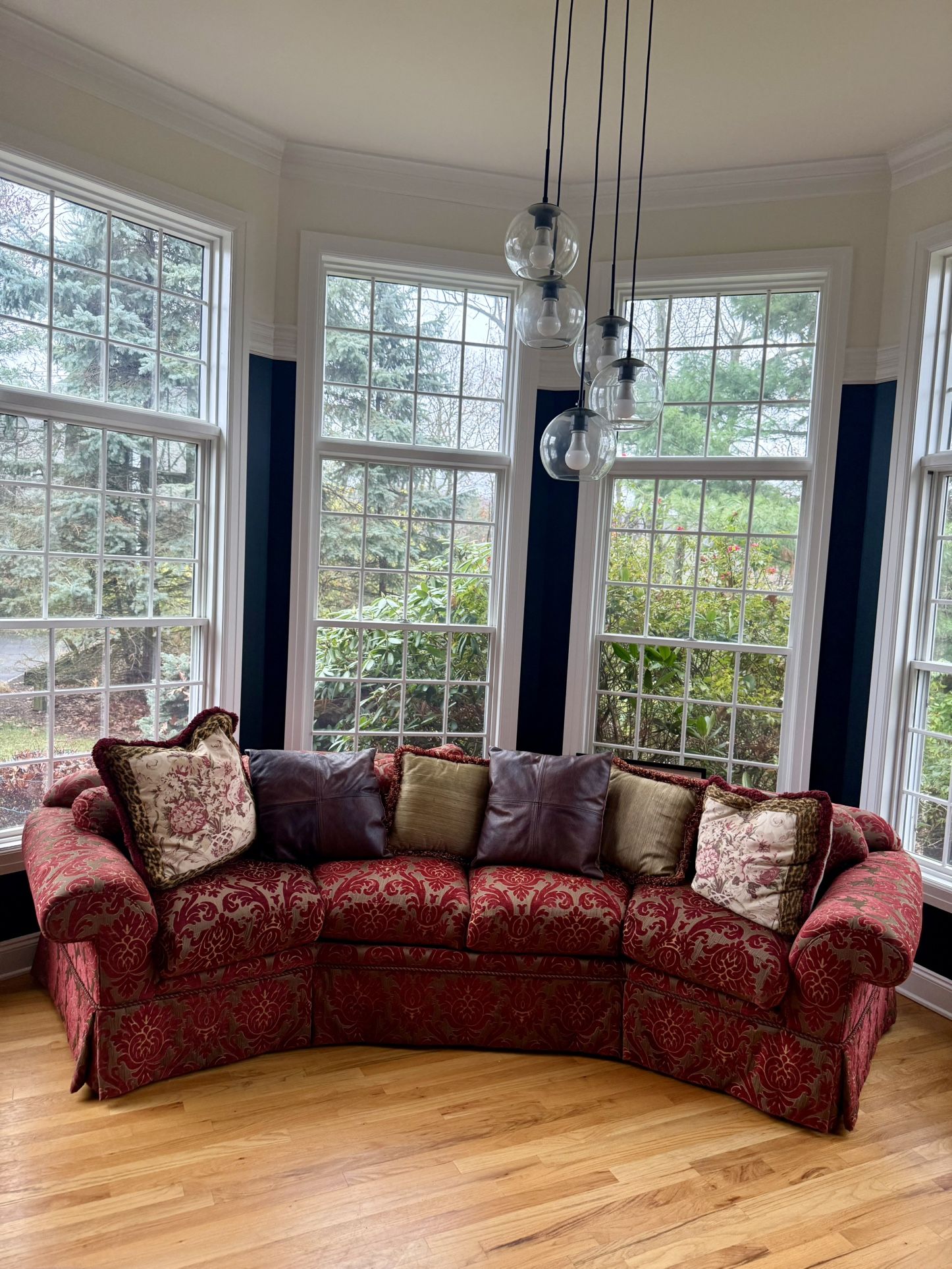 Elegant Curved Sofa – Red Damask Upholstery