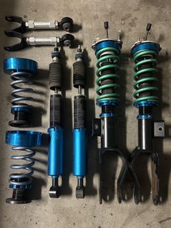Unplugged Performance Luxury Coilovers And Rear Camber Arms For 2020-2024 Tesla Model Y LR Performance