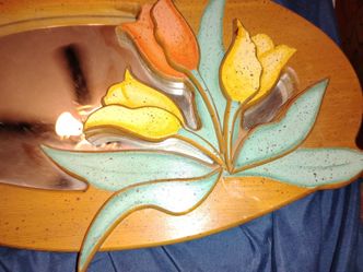 Wood framed mirror with floral accents