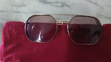Christian Dior glasses made in Germany gold lenses or like bifocal to take them out and put sunglasses in if you want vintage
