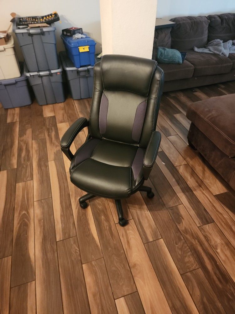 Black Serta-brand office chair. 