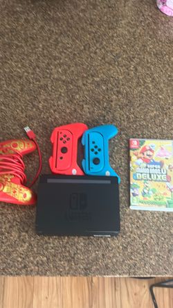 Used Nintendo Switch V1, Nintendo Switch Controller, Super Mario Bros Deluxe 3, NBA 2K 23, Both Controllers and Controller bases