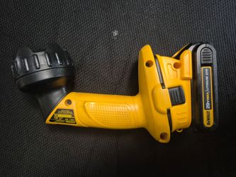 DEWALT DW908 pivoting head flashlight and the attached 20V battery