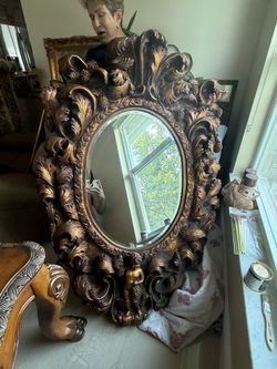Antique cherub mirror