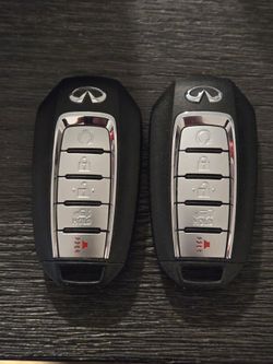 Two Infiniti key fobs