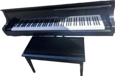 Black. An original Japanese grand piano; it has been wrapped and is currently stored in an air-conditioned warehouse. Reluctantly parting with these i