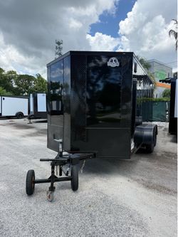 Trailer enclosed 7 x 14 with a spoiler with electric brake teach Cargo financing available