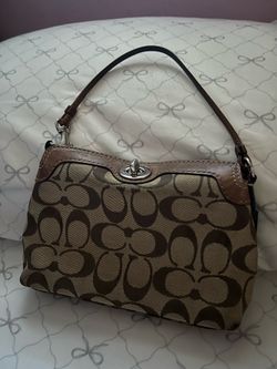 Turn lock Coach wristlet