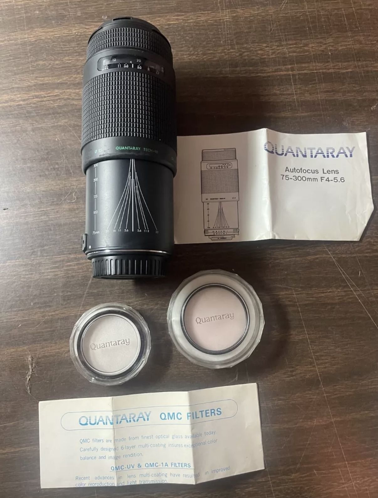 Quantaray AF 75-300mm f4.5-5.6 zoom lens  w/ 2 filters,  caps, Japan