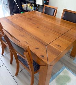 Real wood dining table with 4 chairs and bench $100 as is