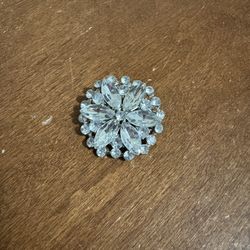 Elegant Crystal Brooch Stunning crystal brooch with intricate design.