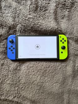 Nintendo Switch OLED with Blue and Yellow Joy-Cons