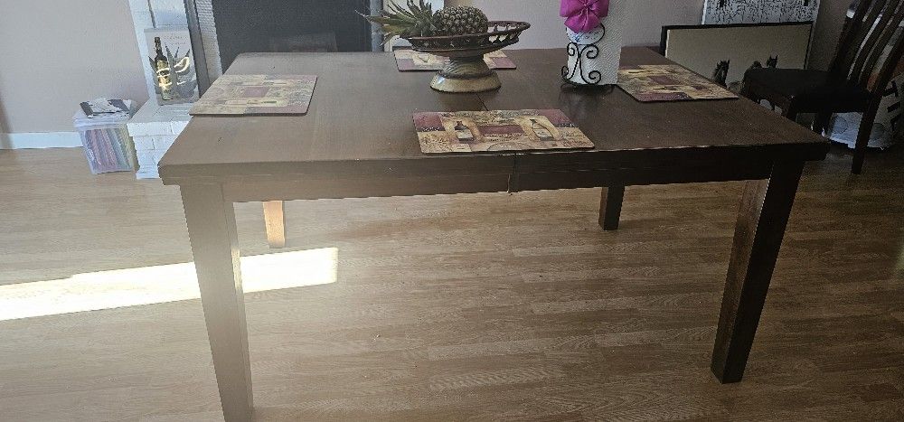 Wooden table for 4 chairs and can be made larger for 8 chairs