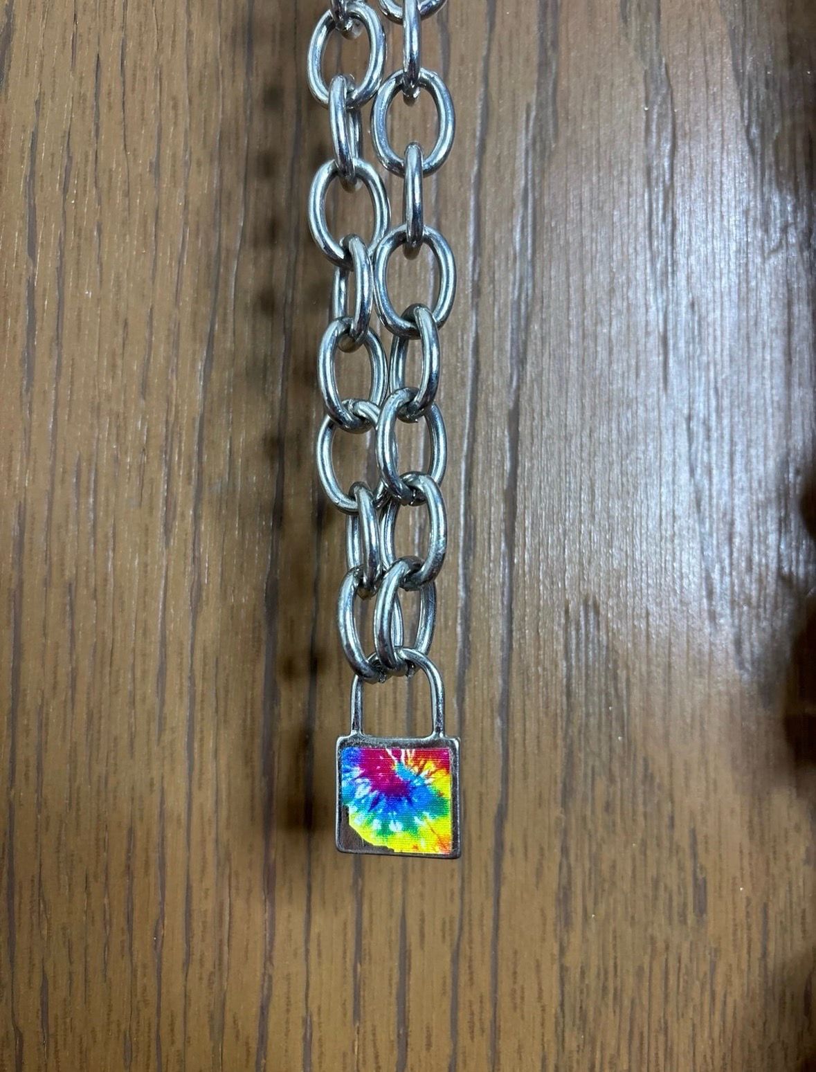 Tie-dye padlock pendant on thick necklace chain with lobster claw clasp