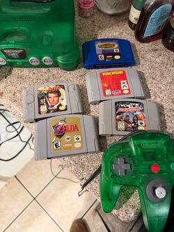 N64 Nintendo translucent jungle green with games controller all cords jumper pack all tested and working