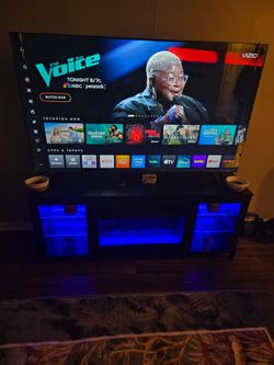 Vision 65 inch television,led lights fire place, 2 piece coaches with three piece table set , dining room table two piece dresser set
