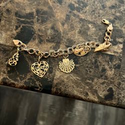 Italy 14k Good With 5 14k Gold Charms On It 