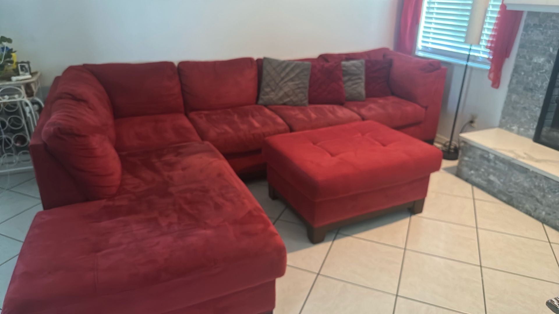 Living Room Sectional With ottoman And Decorative Pillows, Separate Recliner Chair, Wall Art And Curtains