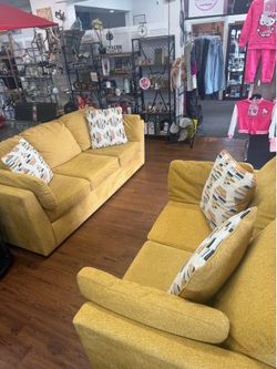 Only 1 year old Ashley solid couch and love seat