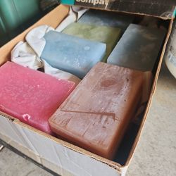 a case of wax bars for making candles 