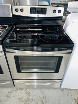 Kenmore stainless steel electric stove with a receipt for a 60-day warranty
